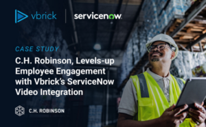 man with safety vest and clipboard inside a warehouse