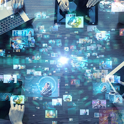 Abstract image of floating images and screens in a dark background with central light in the middle