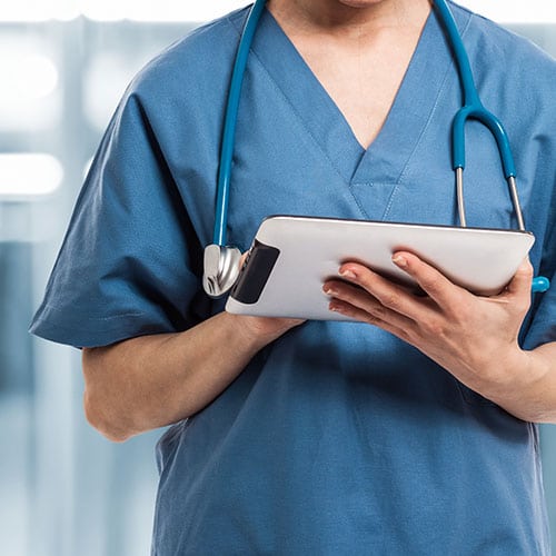 Image of doctor holding an ipad