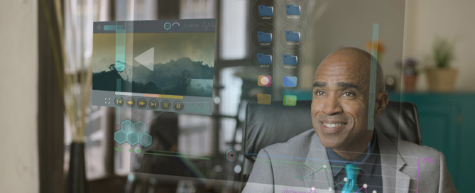 Abstract image of a man smiling, looking at floating video and files
